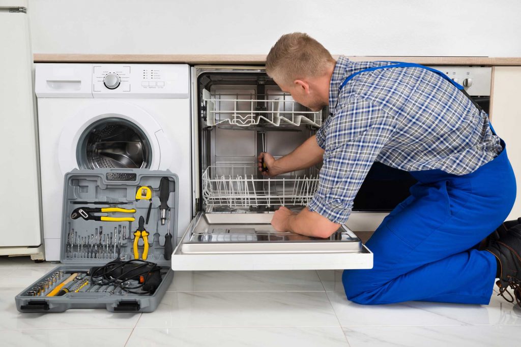 technician fixing a dishwasher repair atlanta