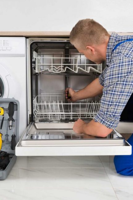 technician fixing a dishwasher repair atlanta